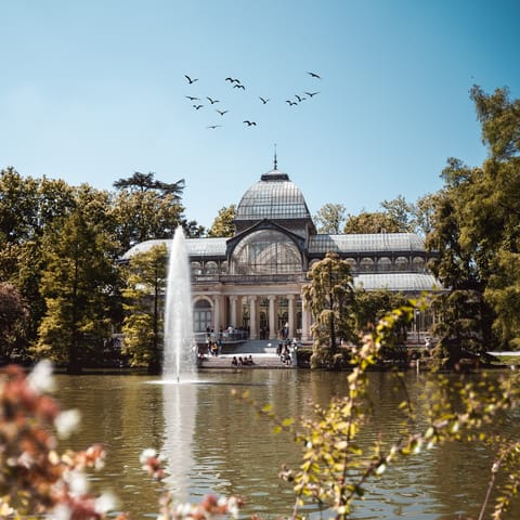 Tuck into a picnic in El Retiro Park, just over a ten-minute walk from your building