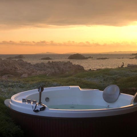 Sip local wine in the Jacuzzi as the sun is setting over the sea