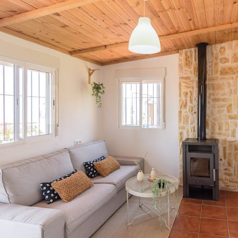 Snuggle up by the living room's fireplace on cooler evenings, a glass of Spanish wine in hand