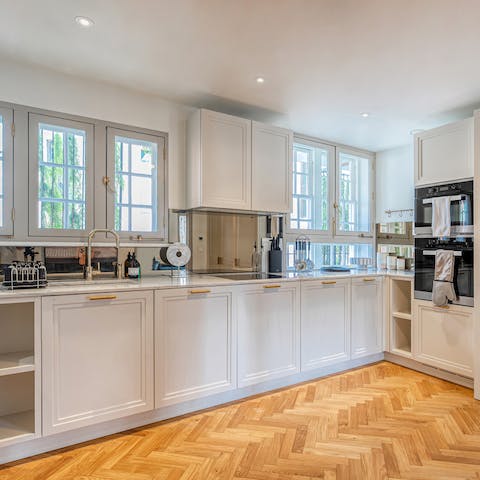 Cook up some bangers and mash in the fully-equipped modern kitchen