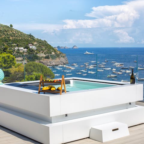 Sink back into the soothing waters of the rooftop Jacuzzi