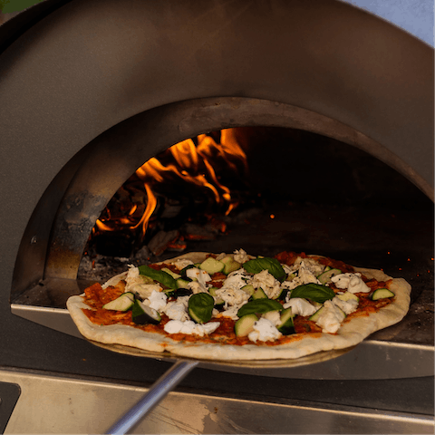 Cook up a mouth-watering dinner on the pizza oven and barbecue