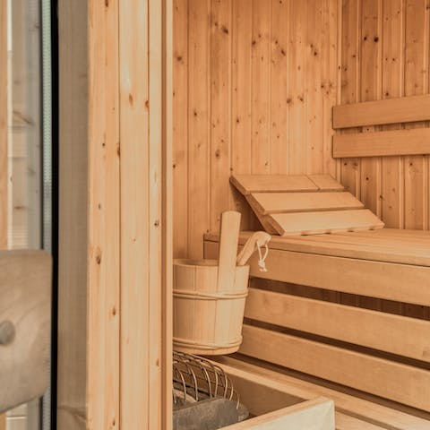 Tend to muscles sore from mountain adventures in the private sauna