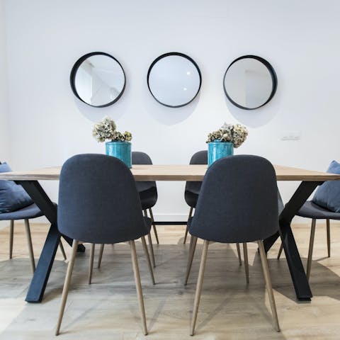 Gather around the sleek table for family feasts