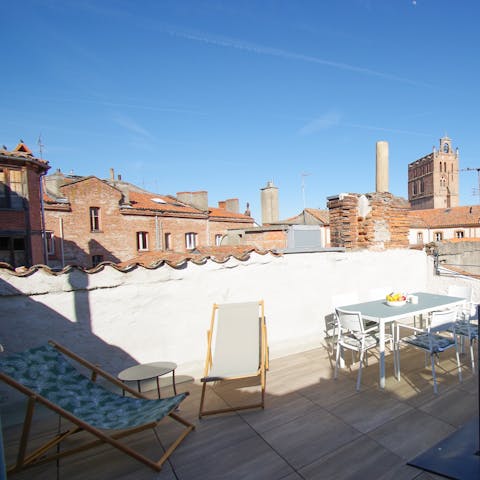 Stretch out in the rooftop loungers and turn pages of your new book