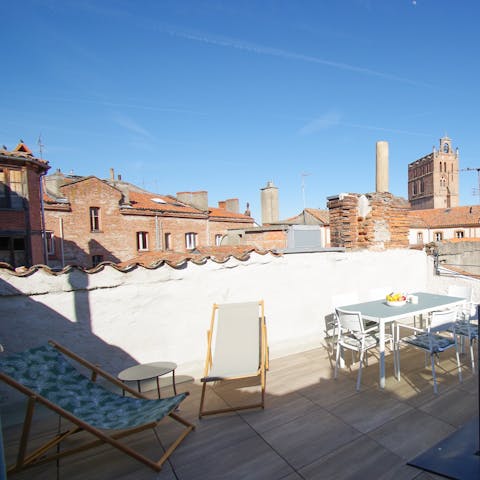 Stretch out in the rooftop loungers and turn pages of your new book
