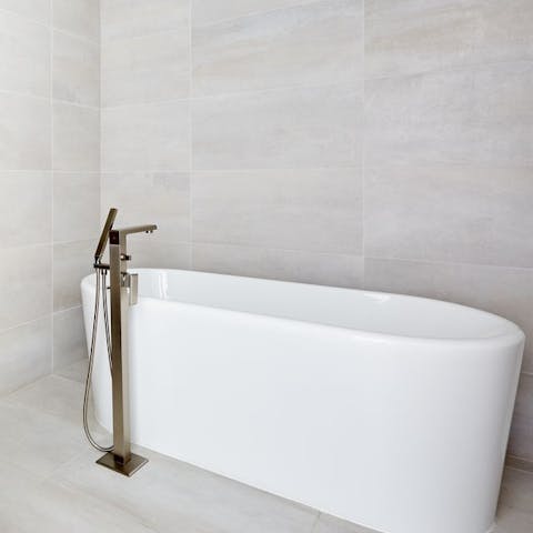 Soak in the enormous free standing bathtub, after a day on Miami Beach