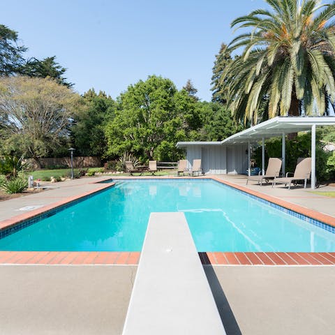 Dive into the pristine swimming pool to cool off