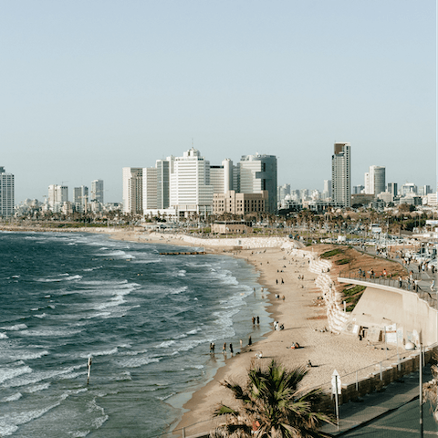Spend a day on the sands of Charles Clore Beach, a short bus ride away