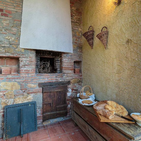 Cook up some dinner in the wood-fired pizza oven