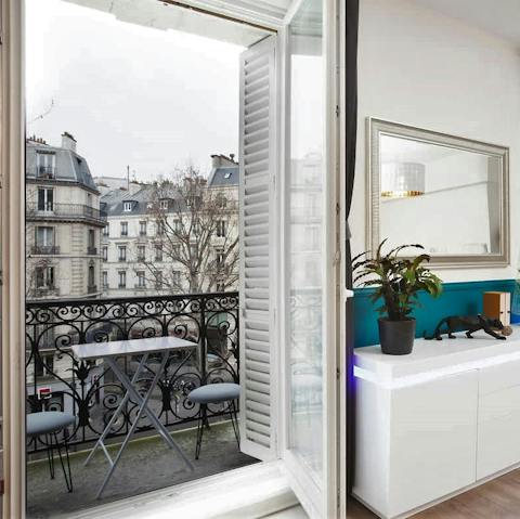Have a glass of champagne on your balcony and admire the Parisian architecture 