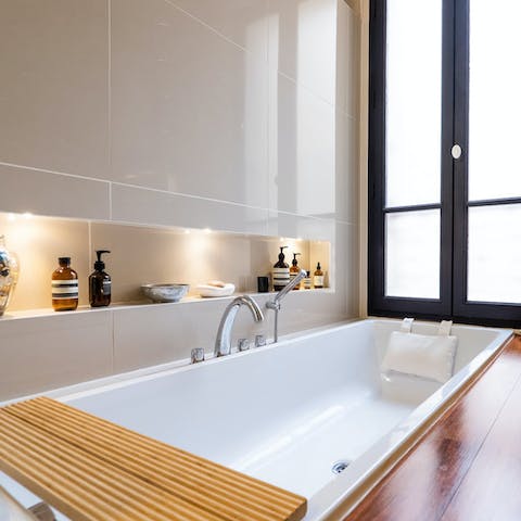 Take a relaxing soak in the spa-style sunken bath