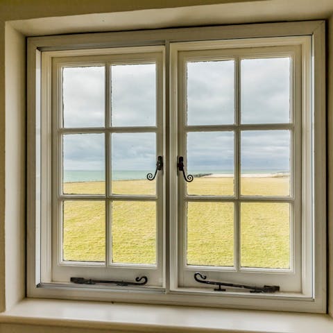 Watch the waves rolling in from the home's picture windows