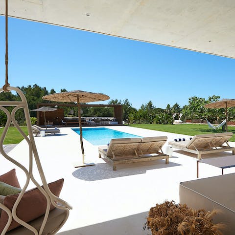 Relax in one of several chill out areas surrounding the pristine pool