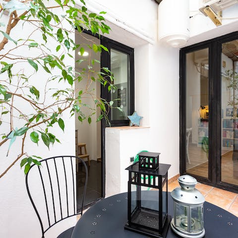 Wake up and step outside onto the private patio – an oasis in the heart of the city