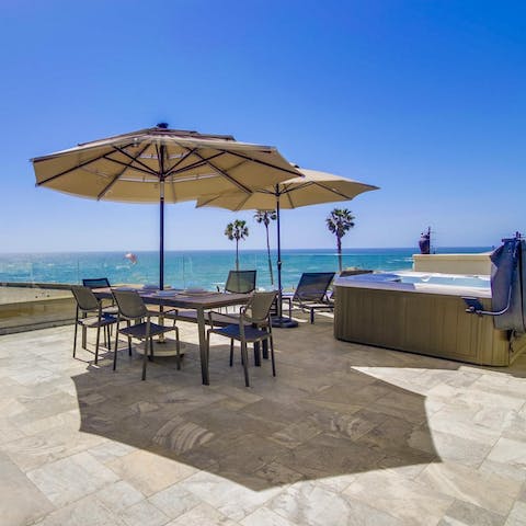 Spend sunny days on the roof deck, soaking up the sun from the hot tub