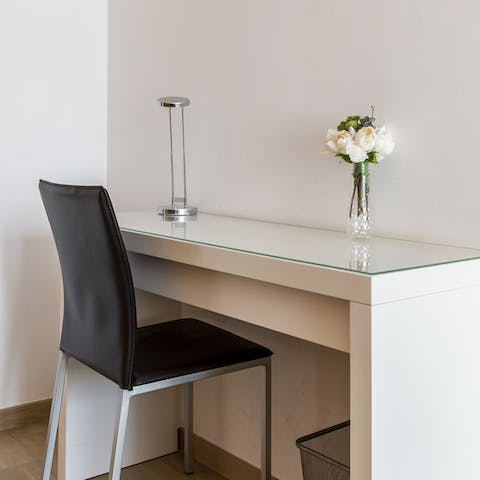 Catch up on work at the sleek desk space