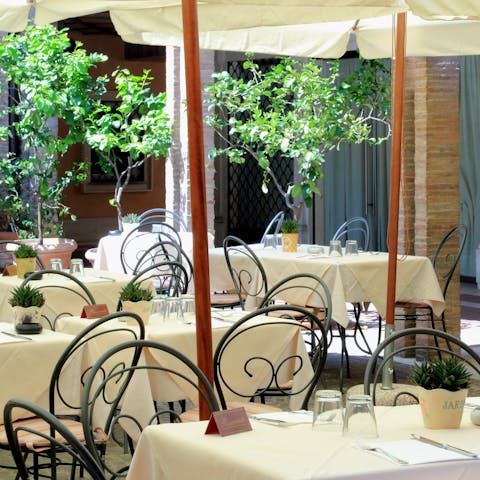 Go for a meal in the courtyard restaurant that's part of the building