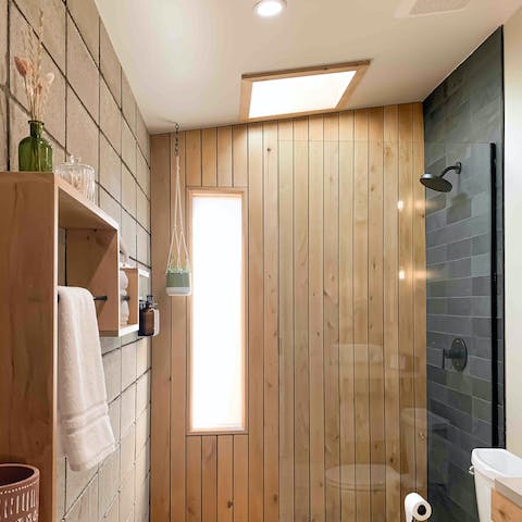 Enjoy relaxing soaks in the spa-like wood shower