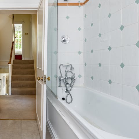 Treat yourself to a rejuvenating soak in one of the home's two bathtubs