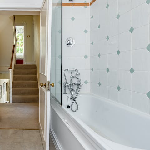 Treat yourself to a rejuvenating soak in one of the home's two bathtubs