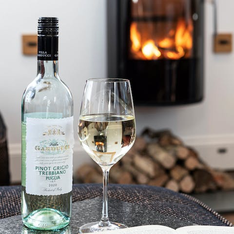 Curl up in front of the log burner with a glass of wine 