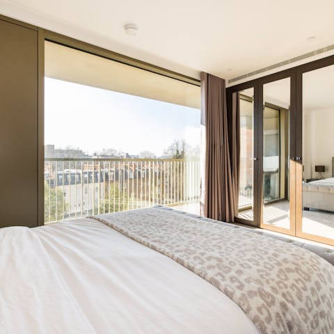 Step out of bed and onto the apartment's private balcony to start your day