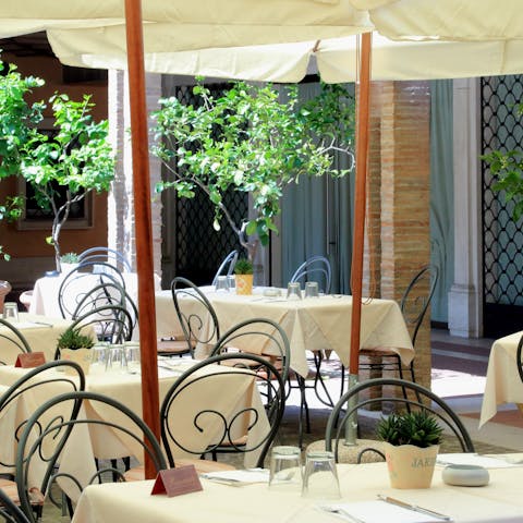 Enjoy a delicious meal in the courtyard restaurant that is located in the building