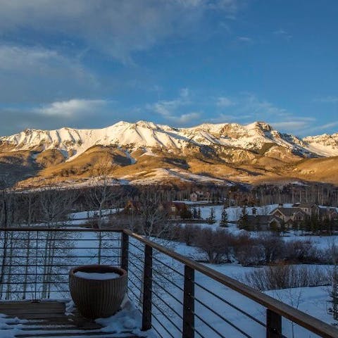 Watch the sun rise over the mountains in the distance