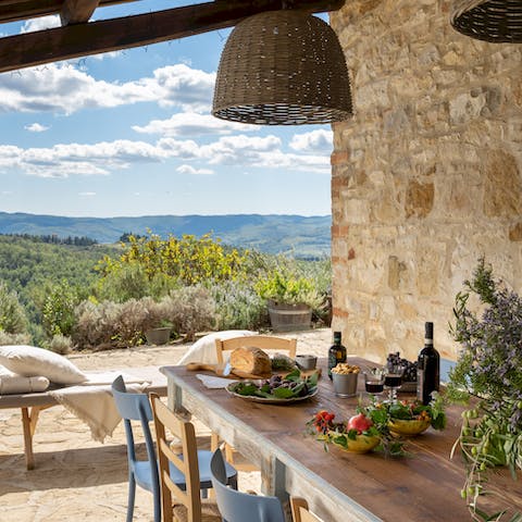 Dine alfresco to the backdrop of the rolling Tuscan hills