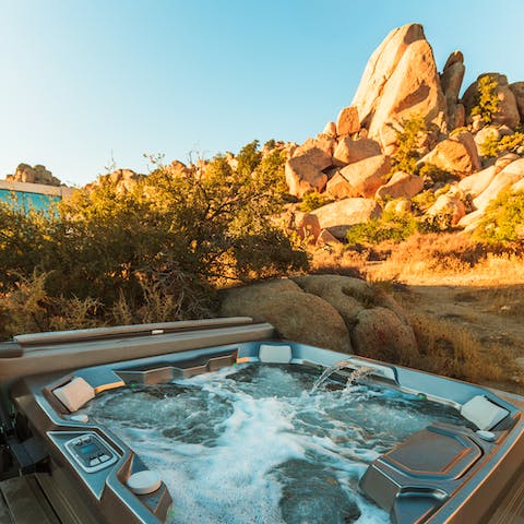 Soak in the saltwater hot tub as the sun goes down