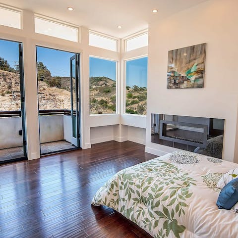 Take in the hilltop views from the striking master bedroom and its balcony