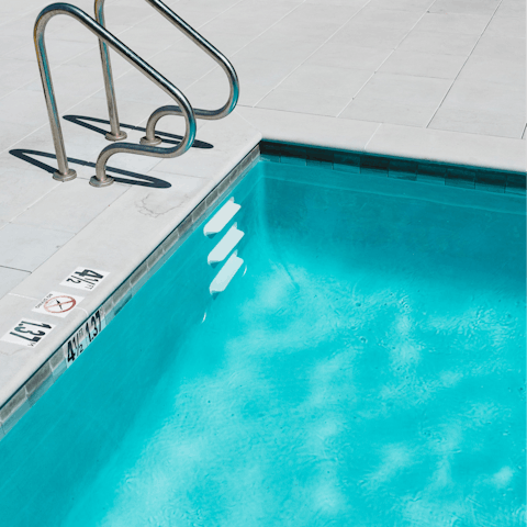 Get refreshed in the building's communal pool