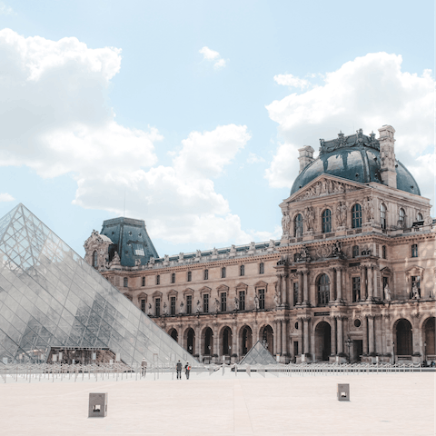 Walk to the famous Louvre Museum, where the Mona Lisa hangs