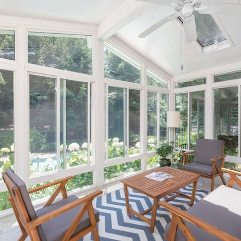 Keep an eye on the kids from the sunroom overlooking the pool