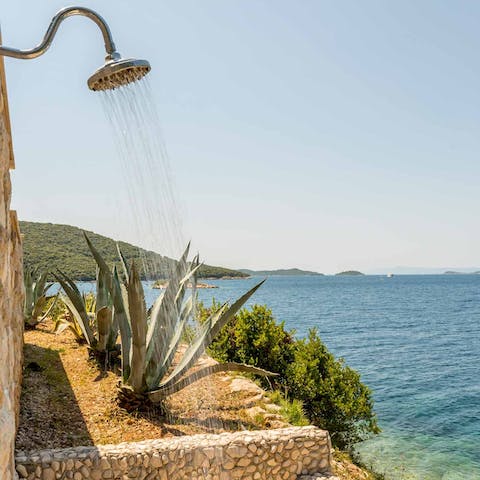 Feel anew beneath the outdoor shower with a view