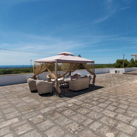 Seek some shade on the rooftop terrace with a sea view to keep you company