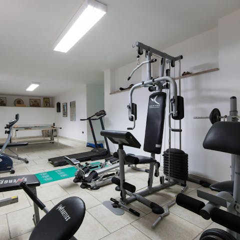 Start the day with an endorphin-boosting workout in the villa's gym