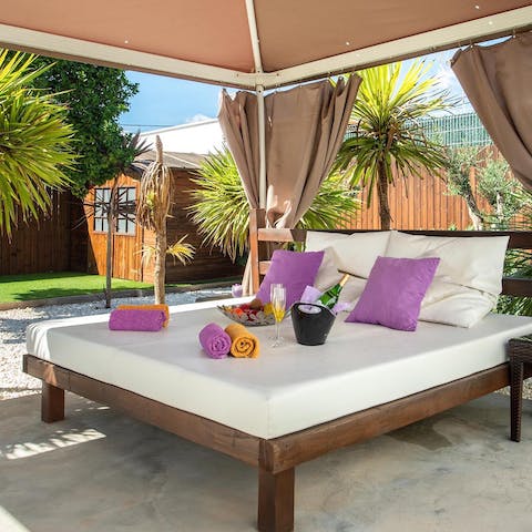 Enjoy an afternoon snooze on the daybed in the garden