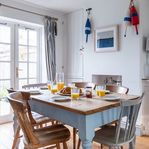 Set the table in the nautical-inspired dining room ready for a hearty, home-cooked breakfast