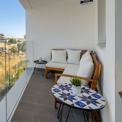 Enjoy your morning coffee on the private balcony