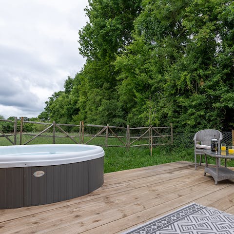 Head out to the terrace for a soak in the private hot tub