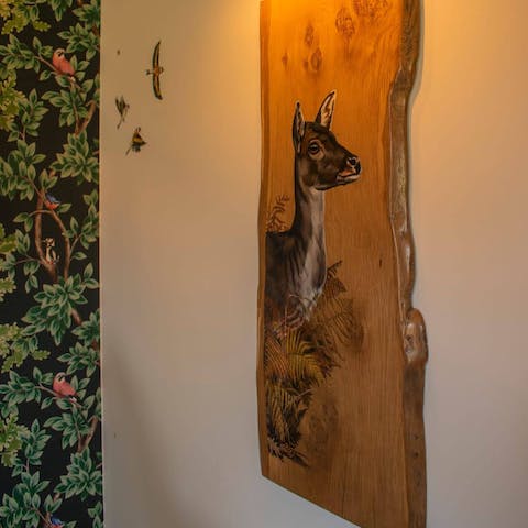 Admire the beautiful decor inspired by the woodland and wildlife surroundings