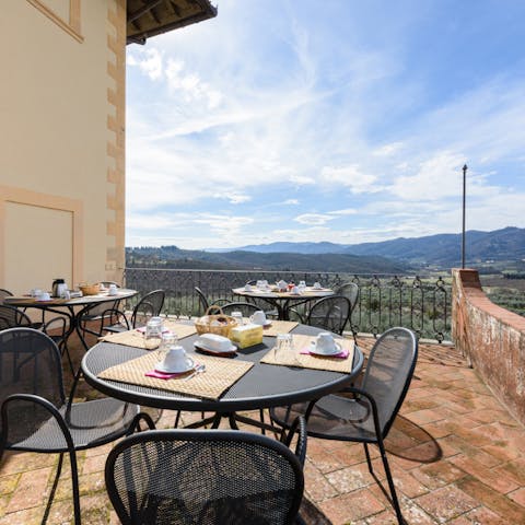Set up for breakfast on the terrace with a view over the Tuscan hills