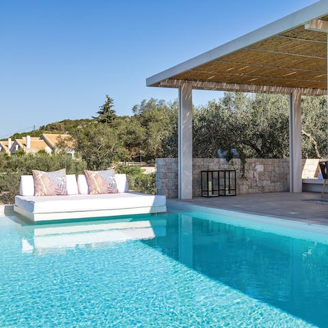 Sunbathe on the daybed before plunging into the cool water of your private pool