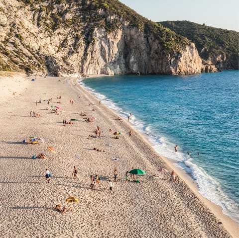 Chill out on the soft sands of Pefkoulia Beach, a six-minute drive from your home
