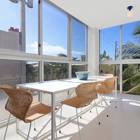 Eat together in the cheery glass-paneled dining room