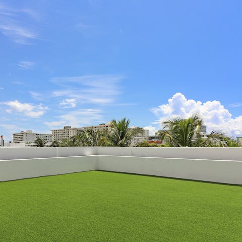 Fit in some morning stretches on the grassy roof terrace