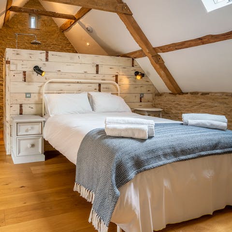 Sleep soundly beneath the vaulted ceiling and original oak beams