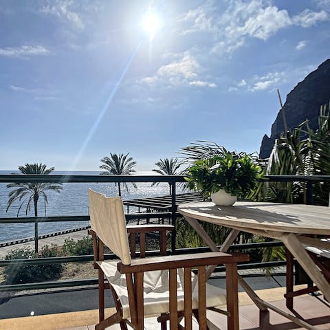 Soak up the sun while relaxing out on your private balcony overlooking the ocean and mountains
